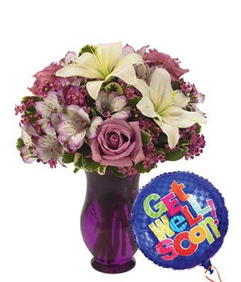 White lilies with purple roses with get well balloon