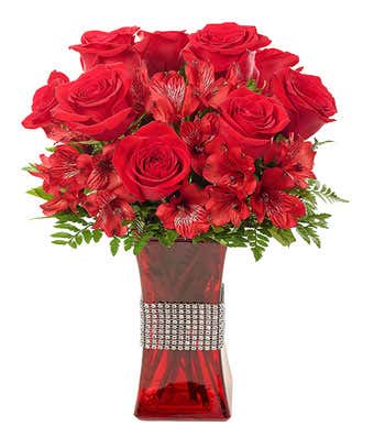 red roses and red alstroemeria delivered in a tall red vase