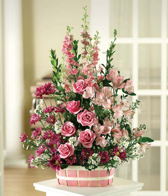 Pink roses and pink alstroemeria in a basket 