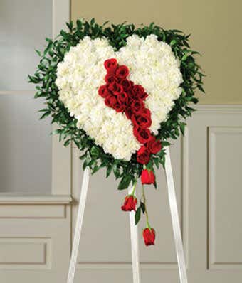 Bleeding heart standing spray with red roses