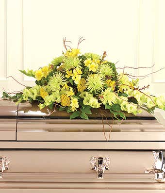 flower casket spray with yellow flowers