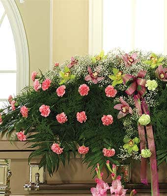 Pink carnations and orchid casket spray