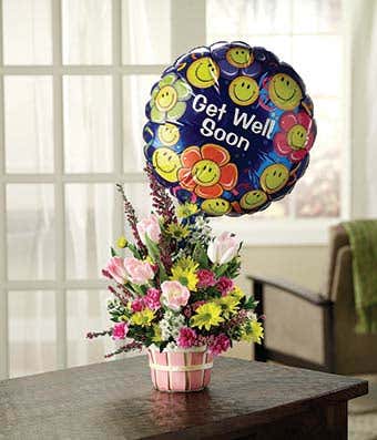 Pink tulips, yellow daisies and purple heather with get well balloon