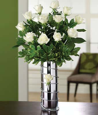 One dozen white roses in silver vase