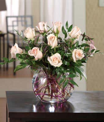 Pink roses delivered in a glass bubble vase