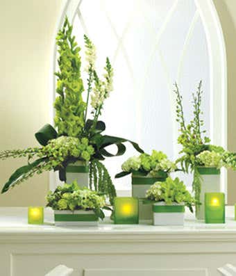 Green rose, orchids and hydrangea alter arrangement