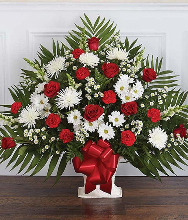 Red roses and white flower sympathy floor basket