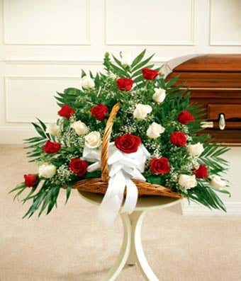 fireside funeral basket with two dozen long stem red roses