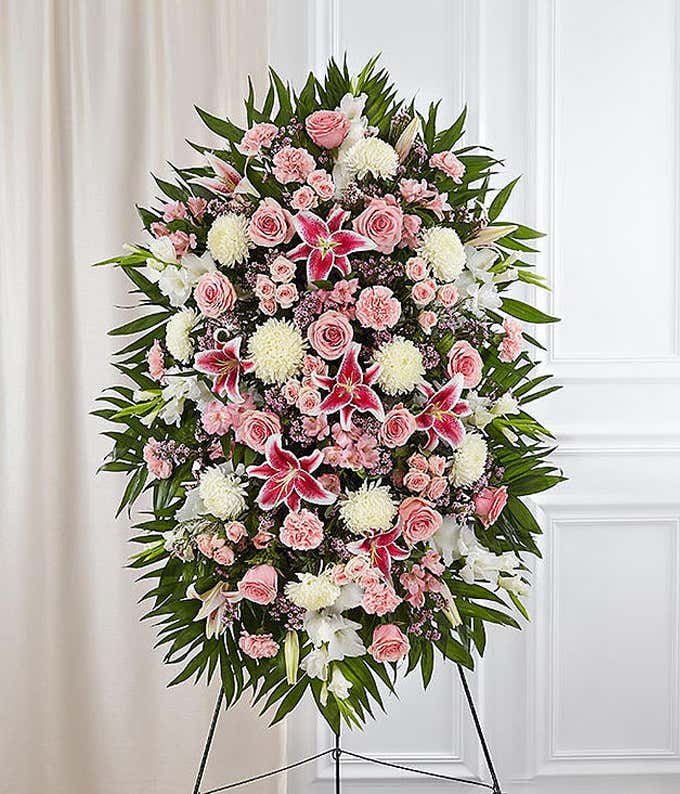 Pink roses, pink lilies and white mums in standing spray