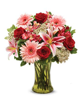 Flowers for sympathy with red roses, pink lilies and pink daisies