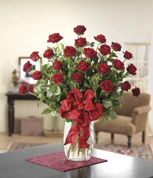 Two doze long stemmed red roses