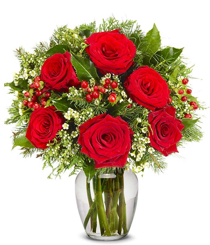 Red roses with red hypericum berries