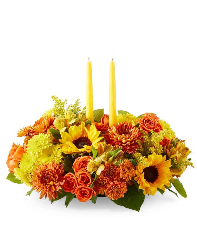 Yellow Sunflowers &amp; Alstroemeria, Butterscotch &amp; Yellow Poms, Orane Spray Roses, two yellow candle sticks in the center, against a white background