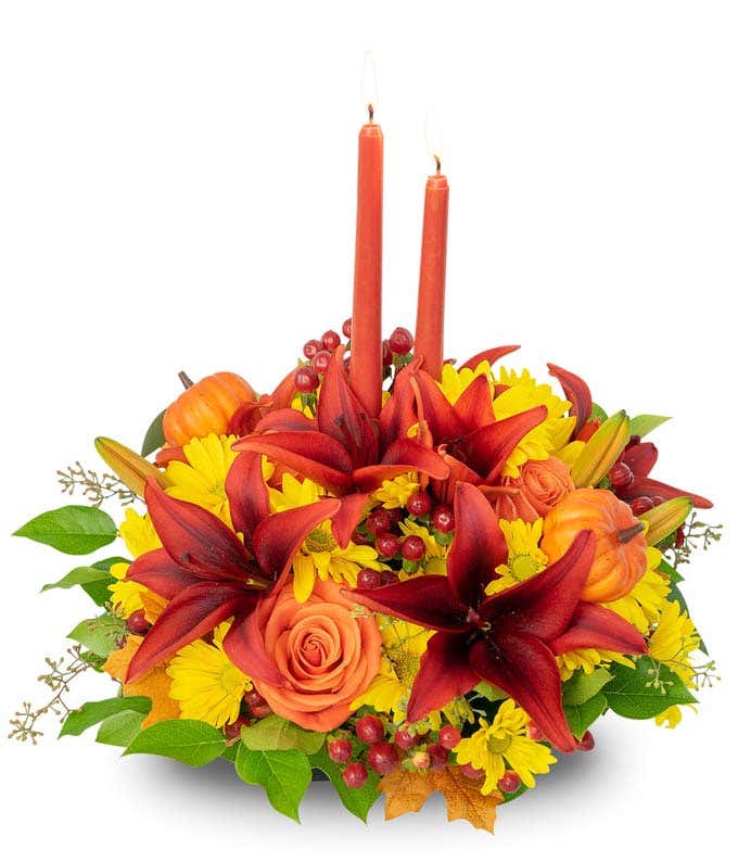 Pumpkin candle flower centerpiece